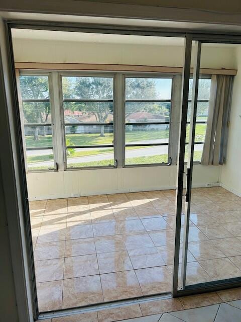 entryway featuring light tile patterned floors