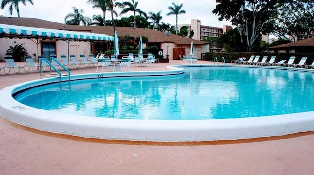 community pool with a patio