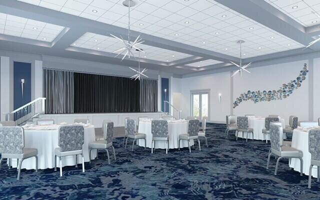 carpeted dining area with recessed lighting, a towering ceiling, and an inviting chandelier