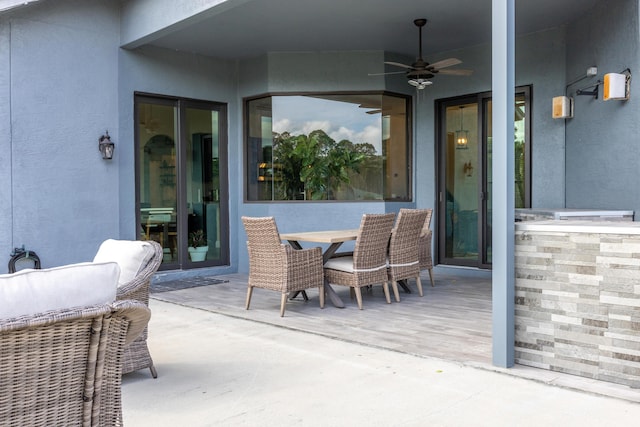 view of patio featuring ceiling fan and outdoor dining area