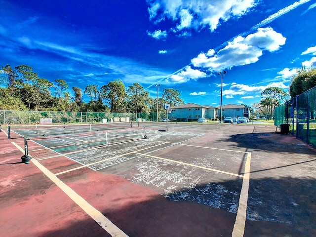 view of sport court with fence