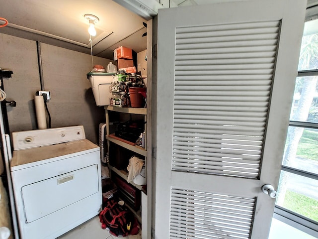 clothes washing area featuring washer / dryer