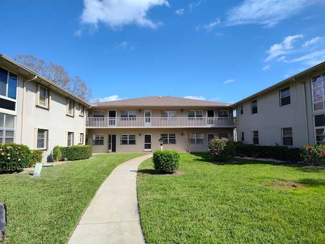 view of home's community with a lawn