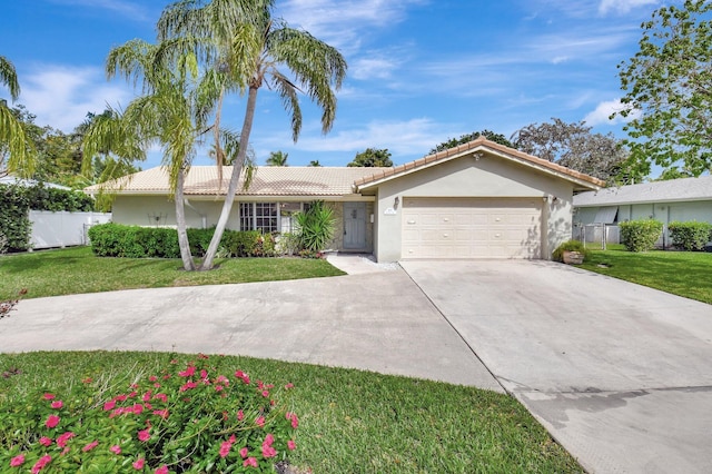 ranch-style house featuring an attached garage, concrete driveway, a front yard, and stucco siding