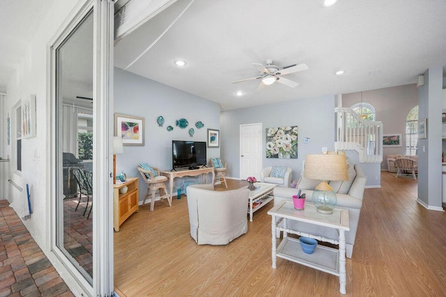 living area with recessed lighting, baseboards, ceiling fan, and light wood finished floors