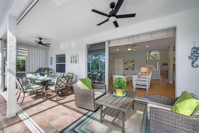 exterior space with ceiling fan, outdoor dining area, and an outdoor hangout area