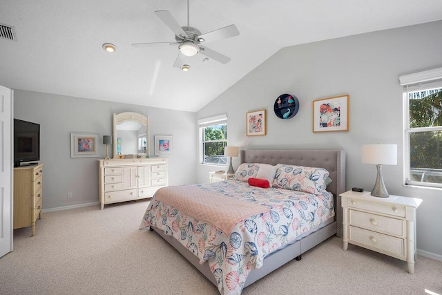 bedroom featuring vaulted ceiling, ceiling fan, baseboards, and light colored carpet