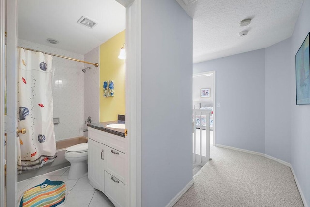 full bathroom with visible vents, toilet, shower / bath combo, vanity, and tile patterned flooring