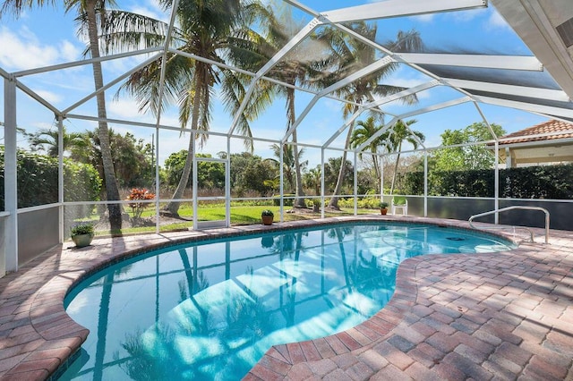 pool with a lanai and a patio