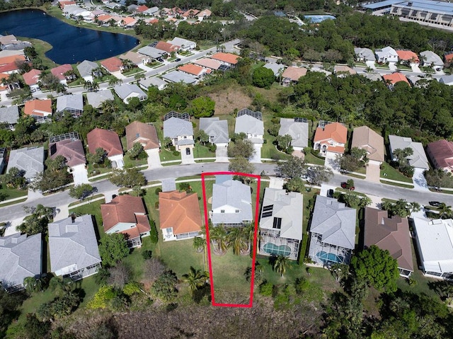 aerial view featuring a water view and a residential view