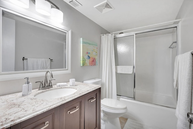 154 Lake Meryl Dr Unit 255, West Palm Beach, FL 33411 - bathroom featuring vanity, toilet, and shower / bath combination with glass door