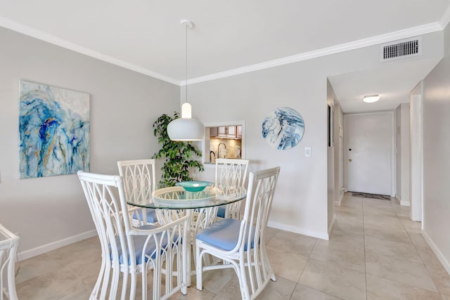 dining area featuring ornamental molding, visible vents, baseboards, and light tile patterned floors