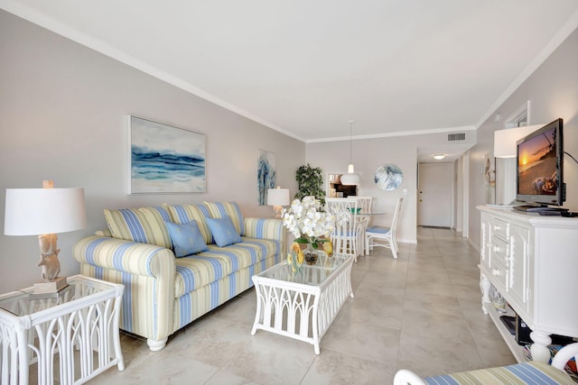 living room with ornamental molding, baseboards, and light tile patterned floors