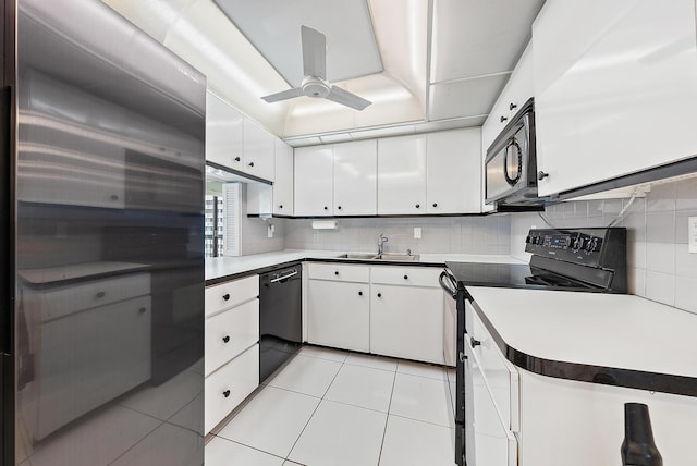 kitchen featuring backsplash, black appliances, ceiling fan, light tile patterned flooring, and white cabinetry