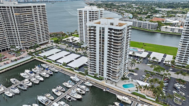 drone / aerial view featuring a view of city and a water view