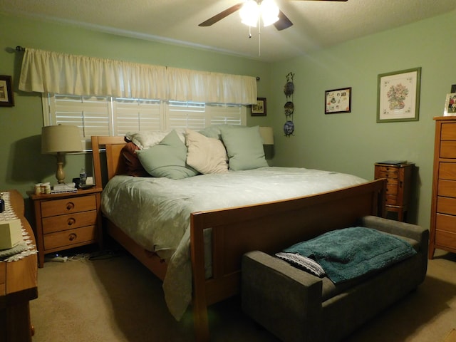 bedroom featuring ceiling fan and light colored carpet