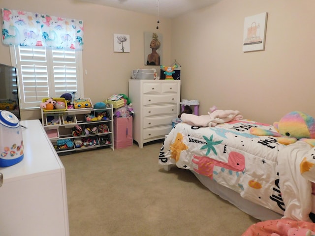 bedroom featuring light carpet