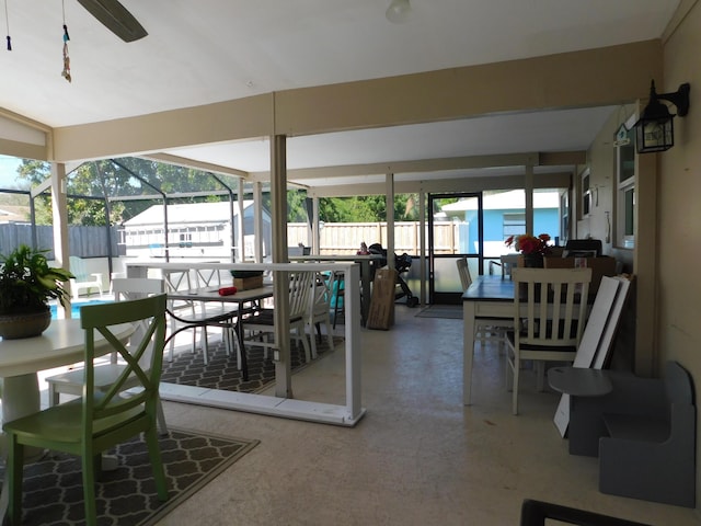 interior space with ceiling fan and a sunroom