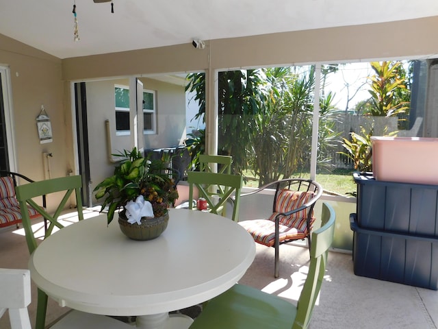 sunroom with lofted ceiling