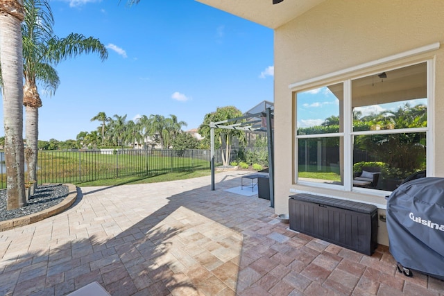 view of patio / terrace with area for grilling, a fenced backyard, and a pergola