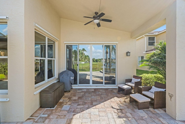 view of patio featuring ceiling fan and a grill