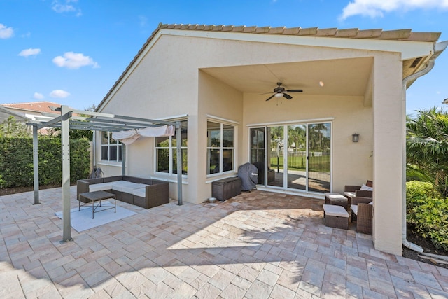 view of patio with ceiling fan, an outdoor living space, and a pergola