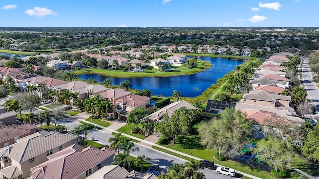 bird's eye view with a water view and a residential view