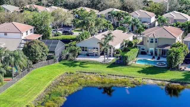 drone / aerial view featuring a residential view and a water view