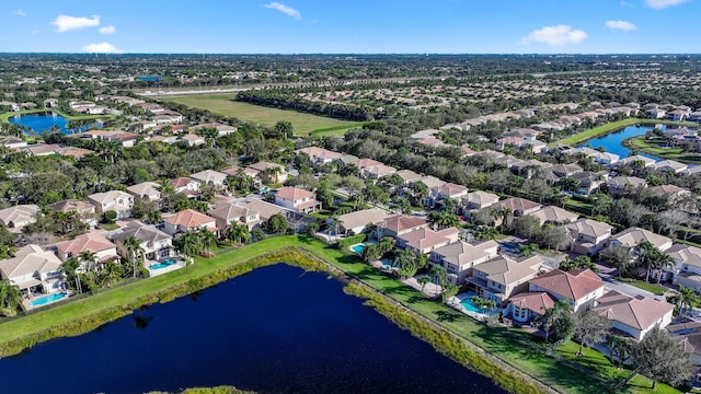 birds eye view of property featuring a water view and a residential view