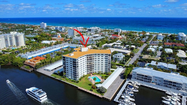 aerial view featuring a view of city and a water view