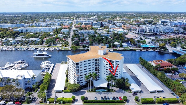 bird's eye view featuring a water view and a city view