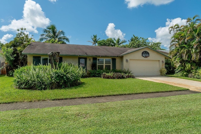 single story home featuring an attached garage, a front yard, concrete driveway, and stucco siding