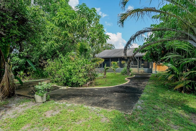 view of yard featuring a sunroom