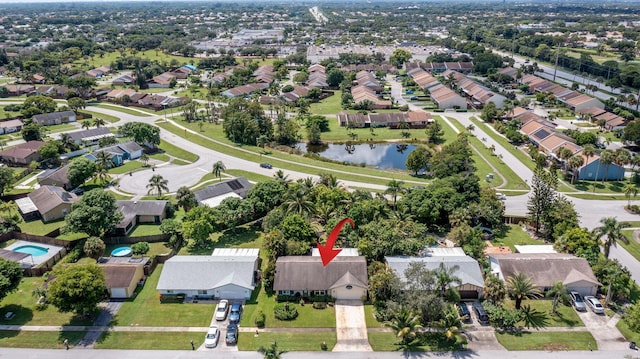 bird's eye view featuring a residential view and a water view