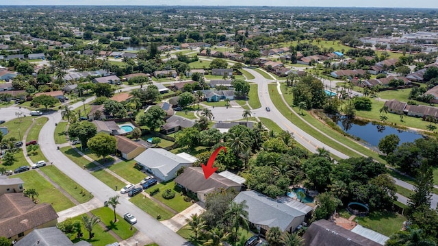 birds eye view of property featuring a residential view and a water view