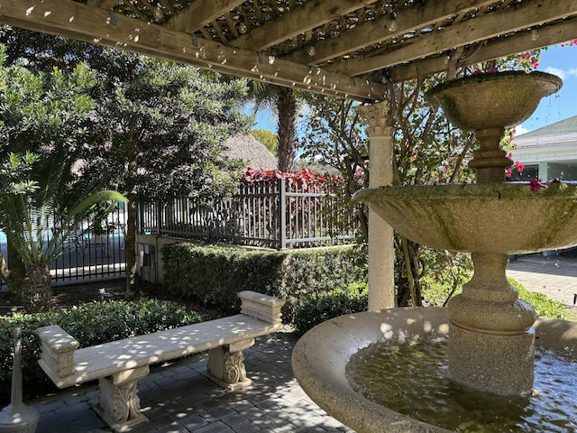 view of patio featuring fence and a pergola