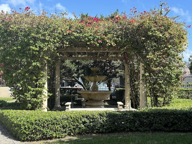 surrounding community featuring fence and a pergola