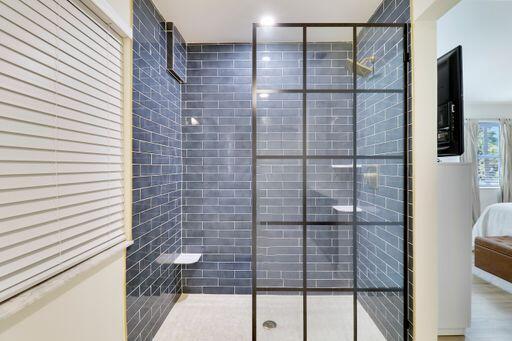 full bathroom with tiled shower