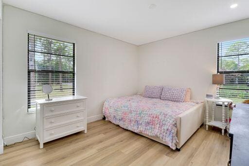 bedroom featuring recessed lighting, baseboards, and light wood finished floors