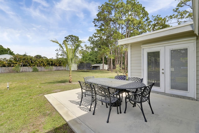 view of patio / terrace with outdoor dining area, fence, and french doors