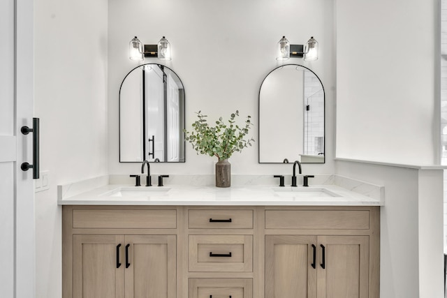 full bathroom featuring double vanity and a sink