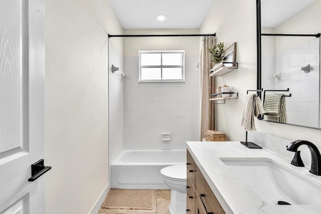 bathroom with shower / tub combination, vanity, and toilet