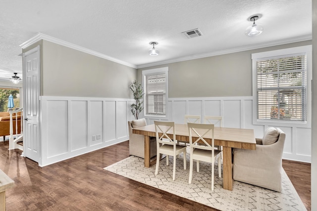 dining space featuring a textured ceiling and a wealth of natural light