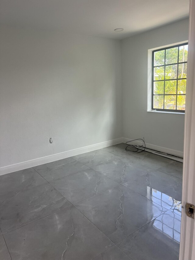 410 S D St, Lake Worth Beach, FL 33460 - unfurnished room featuring baseboards and marble finish floor