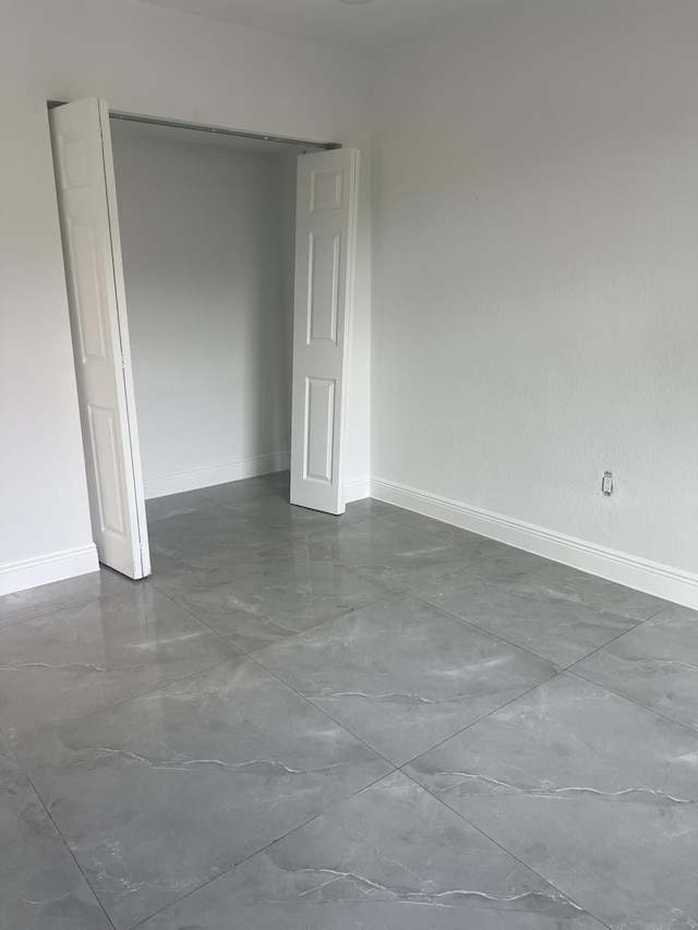 410 S D St, Lake Worth Beach, FL 33460 - empty room with baseboards and marble finish floor