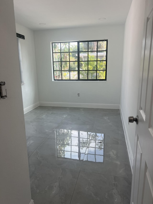 410 S D St, Lake Worth Beach, FL 33460 - unfurnished room featuring baseboards and marble finish floor