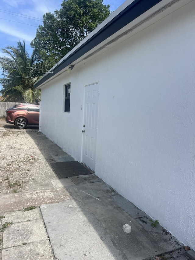 410 S D St, Lake Worth Beach, FL 33460 - view of side of home featuring stucco siding