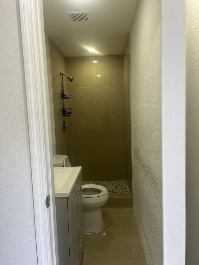 410 S D St, Lake Worth Beach, FL 33460 - bathroom with a shower stall, toilet, tile patterned flooring, and visible vents