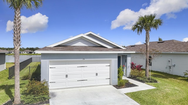 single story home with driveway, an attached garage, fence, a front yard, and stucco siding