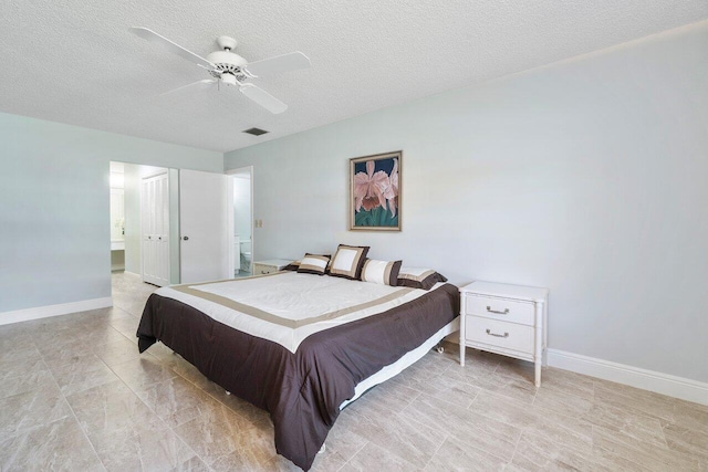 bedroom featuring a ceiling fan, baseboards, visible vents, and a textured ceiling